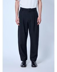 Studio Nicholson - Tuck Cotton Tapered Leg Trousers - Lyst