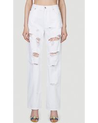 Dolce & Gabbana - Logo Plaque Distressed Jeans - Lyst