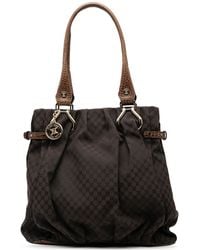 Celine - Embossed Leather Trimmed Macadam Canvas Vertical Tote - Lyst