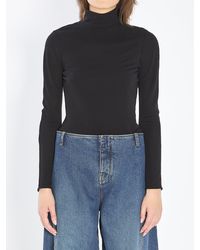 Alaïa - Alaia Fluid Jersey Bodysuit With Heart Cut-Out - Lyst
