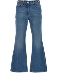 Versace - Flared Denim Jeans With Metallic Jellyfish Detail - Lyst