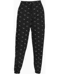 Nike - All-Over Logo Track Pants - Lyst
