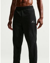 Nike - Therma Fit Solid Patterned Tapered Track Pants - Lyst