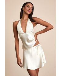 Nia - Nicolas Satin Wrap Mini Skirt - Lyst