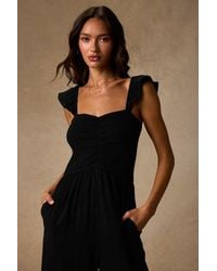 Lulus - Daniyah Smocked Flutter Sleeve Wide-Leg Jumpsuit - Lyst