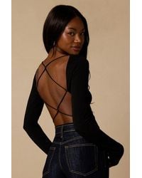 Lulus - Lusa Jersey Knit Lace-Up Bodysuit - Lyst