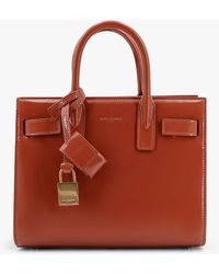 Saint Laurent - Sac De Jour Nano Patent Leather Handbag With Metal Padlock - Lyst