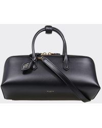 Alaïa - Small Leather Handbag With Double Tubular Handle And Logo Charm - Lyst