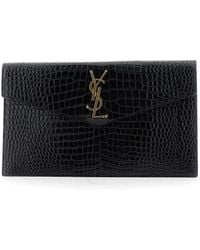 Saint Laurent - Clutch Bag With Logo Plaque On The Front And All-Over Crocodile Effect - Lyst