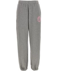 Versace - Brushed Cotton Joggers With Embossed Logo - Lyst
