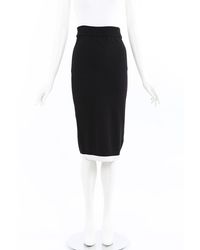 cream skirt black top