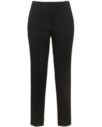 Pantalon à patch logo Synthétique Moncler en coloris Noir Femme Vêtements Pantalons décontractés élégants et chinos Pantalons coupe droite 