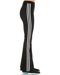adidas originals three stripe flared track pants in black