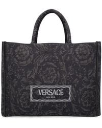Versace - Borsa shopping grande in techno jacquard - Lyst
