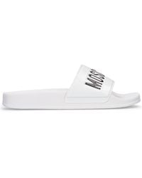 Moschino - Sandales a enfiler a logo blanches - Lyst
