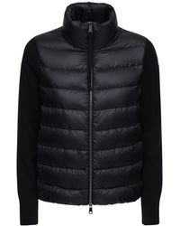 Moncler Knitted Wool And Nylon-blend Down Jacket - Black