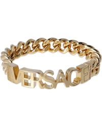 Versace - Bracciale in metallo con logo - Lyst
