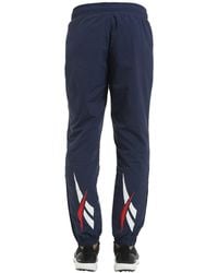 pantalones reebok hombre dorados