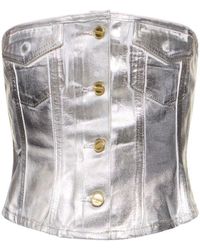 Ganni - Top corsetto in denim spalmato - Lyst