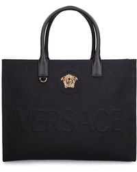 Versace - Borsa shopping in tela con logo - Lyst