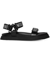 claquettes et tongs Sandales en cuir Homme Chaussures Sandales Claquettes à logo appliqué Moschino pour homme en coloris Noir 