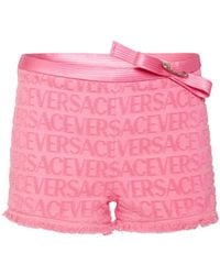 Versace - Shorts dua lipa shorts con logo jacquard - Lyst