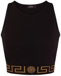 Versace - Top corto de jersey con logo - Lyst