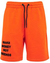 MAKE MONEY NOT FRIENDS Logo Neon Cotton Jersey Sweat Shorts - Orange