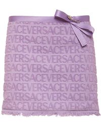 Versace - Jupe courte en jacquard à logo dua lipa - Lyst