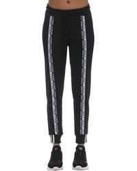 adidas pantaloni a zampa adidas pantaloni a zampa