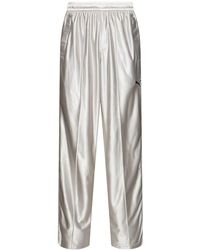PUMA - Pantalones deportivos metalizados - Lyst