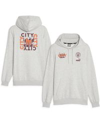 PUMA - Manchester City Ftblcore Graphic Pullover Hoodie - Lyst