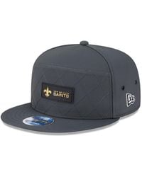 KTZ - New Orleans Saints 2025 Sideline Cold Weather Split Panel 9fifty Snapback Hat - Lyst