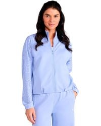 PUMA - Lace Bubble Hem Mock Neck Jacket - Lyst
