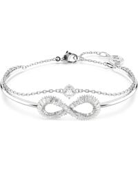 Swarovski - Rhodium-plated Baguette Crystal Infinity Double-row Bangle Bracelet - Lyst