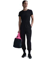 Nike - One Dri-fit Woven High-rise 7/8 joggers - Lyst