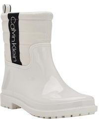 Calvin Klein - Sisely Pull-on Lug Sole Logo Cold Weather Rain Booties - Lyst