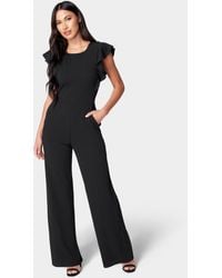 Bebe - Scuba Crepe Jumpsuit With Ruffle Sleeve - Lyst