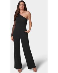 Bebe - Long Sleeve Mesh One Shoulder Jumpsuit - Lyst
