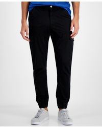 Guess - Stretch-cotton Cargo joggers - Lyst