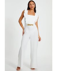 Quiz - Scuba Crepe Chain Front Frill Jumpsuit - Lyst