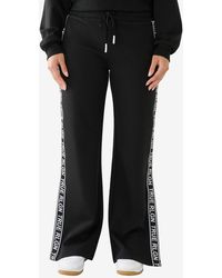 True Religion - Wide Leg Side Taping Track Pants - Lyst
