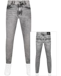 Versace - Couture Dundee Narrow Jeans - Lyst