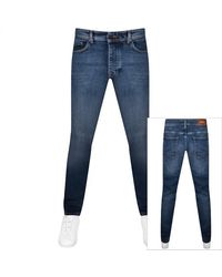 BOSS - Boss Taber Tapered Fit Mid Wash Jeans - Lyst