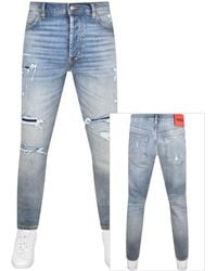 HUGO - 634 Tapered Fit Jeans - Lyst