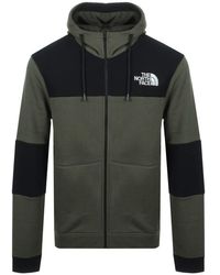 green and black north face tracksuit