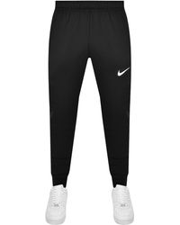 Nike - Training Tapered jogging Bottoms - Lyst