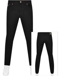 Versace - Couture Dundee Narrow Jeans - Lyst