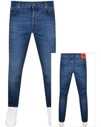 HUGO - 634 Tapered Fit Mid Wash Jeans - Lyst