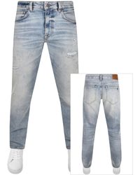 BOSS - Boss Toby Tapered Fit Light Wash Jeans - Lyst